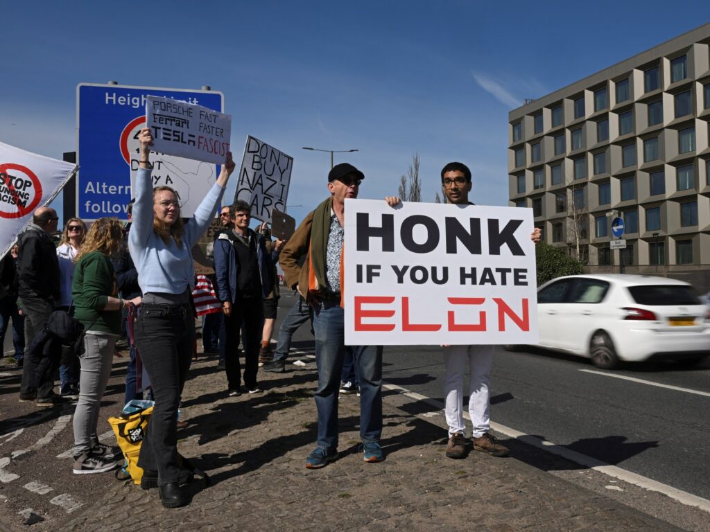 Elon Musk protesters gather at Tesla showrooms | Donald Trump News